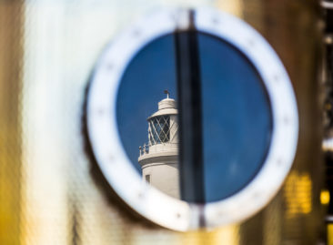 Southwold lighthouse reflected in Adnams copper pot still