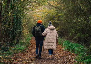 couple going for an autumn walk in the woods